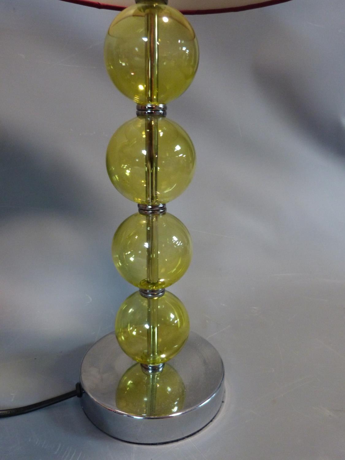 A trio of modern lamps with blown glass bauble stems and satin shades. H 53 cm. - Image 2 of 5