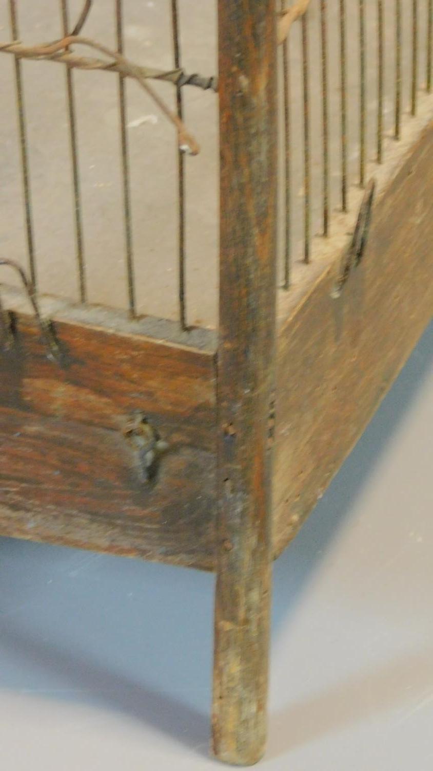 A Victorian style wooden bird cage with exotic birds on perches with wire bars and metal carrying - Image 5 of 5