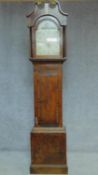 A 19th century oak cased longcase clock with painted arched dial. H.113cm