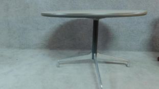 A circular Herman Miller centre table on quadruped aluminium base, label to underside. H.73cm D.