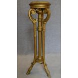 A 19th century carved giltwood torchere stand. H.103cm