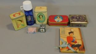 A collection of royal commemorative tins and other items including, thermos, Cadburys chocolate box,