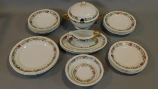 A porcelain dinner set by Thomas Bavaria, with floral and gilded design, stamped to base with the