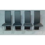 A set of four chrome framed high back dining chairs. H.101cm