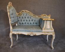 A cream and gilt Louis XV style hall seat with lavish Rococo carving in pale blue buttoned