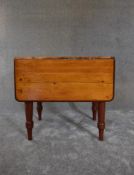 A 19th century pine country dining table with drop flap and draw pull action. H.74 x 60cm