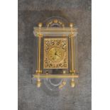 An ornate gilt and perspex wall clock. H.65cm.