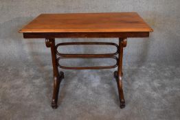 A 19th century bentwood table stamped Austria with a worn original makers label to underside.