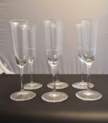 A set of six Reidel champagne flutes. H20cm