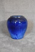 A blue drip glazed pot of bulbous form. H.40 x 35cm