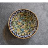 A large Persian ceramic shallow bowl with allover floral pattern. Dia.42cm