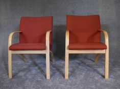 A pair of contemporary ash framed armchairs upholstered in orange fabric. H.55 x 52cm