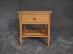 A small teak side table fitted frieze drawer and undertier. H.56 x 52cm