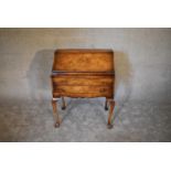 A burr walnut Queen Anne style bureau with fitted interior on cabriole supports. H.100 x 74cm