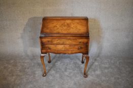 A burr walnut Queen Anne style bureau with fitted interior on cabriole supports. H.100 x 74cm