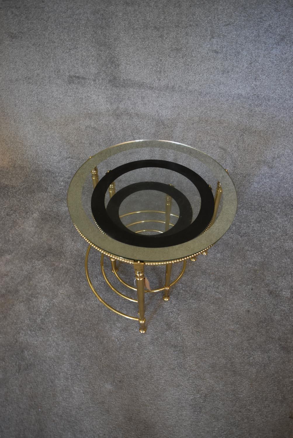 A nest of three brass circular graduating tables with clear glass tops and mirrored edges. Largest - Image 4 of 7