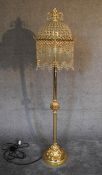 A gilt metal and crystal standard lamp. 1.7m tall