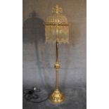 A gilt metal and crystal standard lamp. 1.7m tall