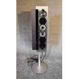 A Bang and Olufsen BeoSound 9000 vertical 6-CD player with floor stand. H 133 x 36cm