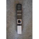 A Bang & Olufsen Beo4 remote controller for BeoSound 9000 6-CD stack, BeoLab 1 speakers, BeoVision