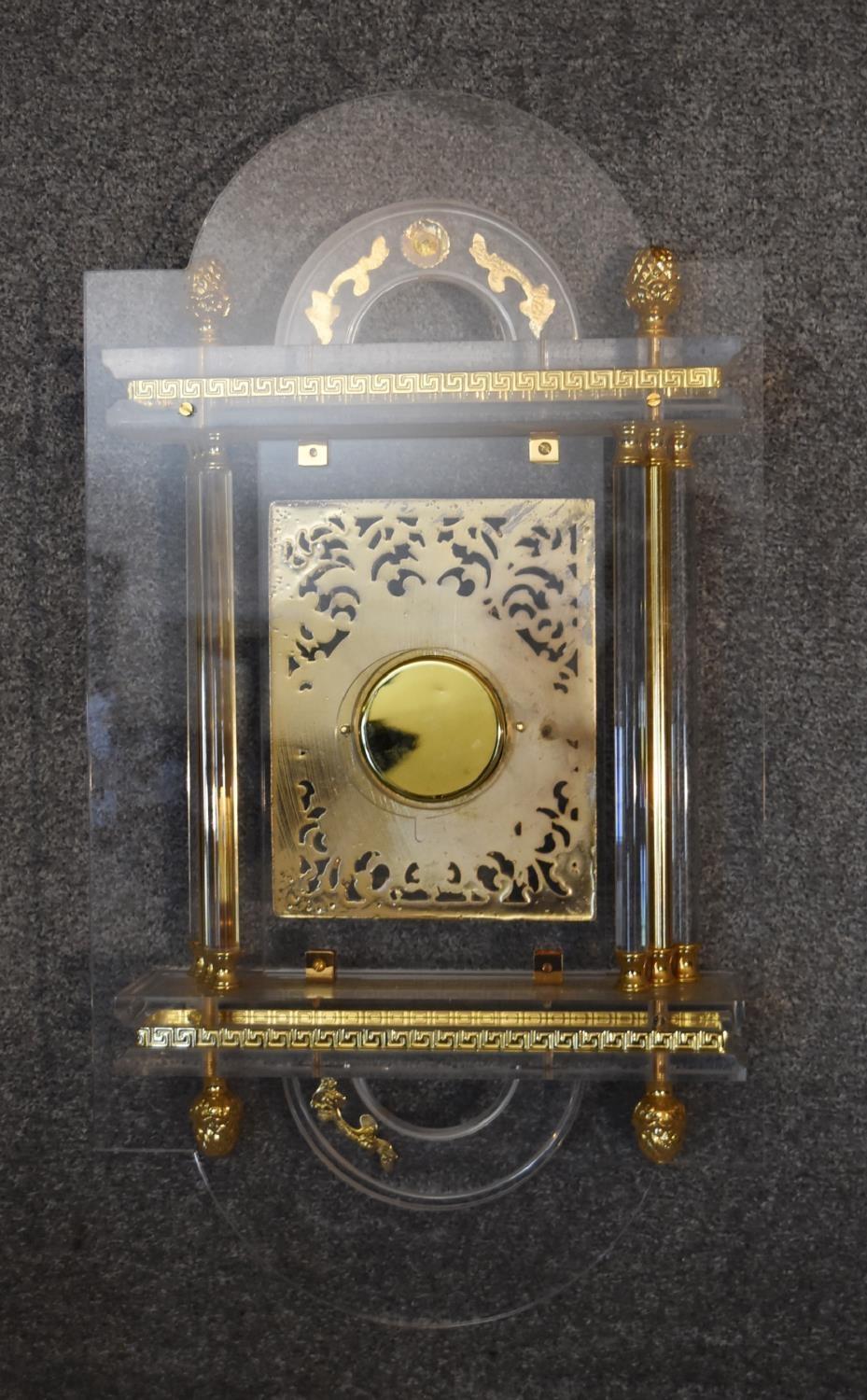 An ornate gilt and perspex wall clock. H.65cm. - Image 5 of 5