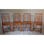 A set of four Chinese hardwood dining chairs on square section stretchered supports. H.100 x 36cm