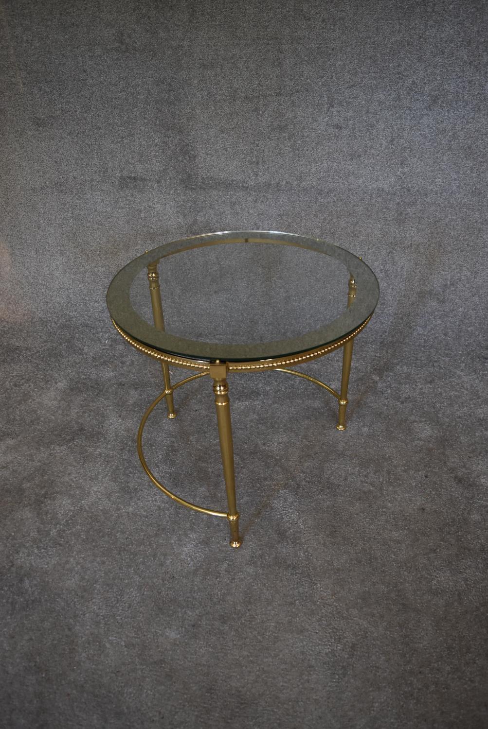 A nest of three brass circular graduating tables with clear glass tops and mirrored edges. Largest - Image 5 of 7