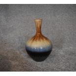 A Persian drip glazed vase of bulbous form. H.26cm