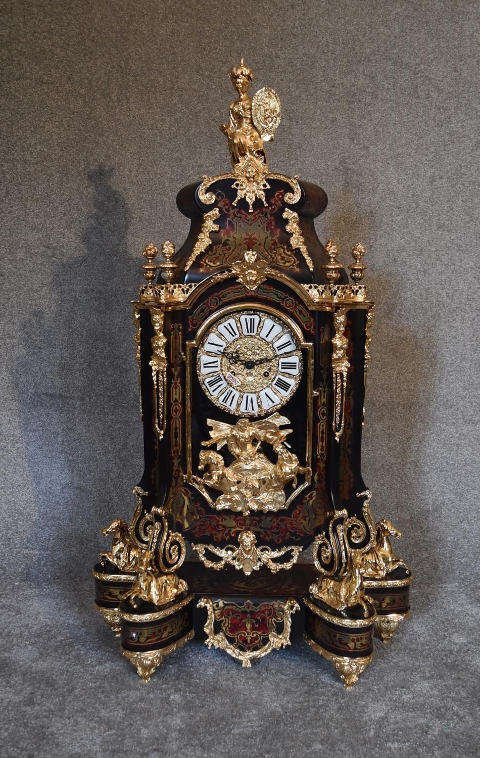 A decorative French style mantel clock in the Boulle manner with figural surmount on matching - Image 2 of 6