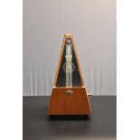 A vintage hand winding Metronome 'Made in the German Democratic Republic'. H.24cm
