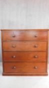 A 19th century mahogany chest fitted with linen drawer with pull out slides above three further