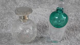 A pair of perfume bottles. One blown turquoise bubble art glass with indistinct signature to base