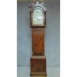 A 19th century oak cased longcase clock with painted arched dial. H.215cm