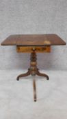 A small 19th century mahogany drop flap work table on turned tripod support. H.71 W.65 D.54cm