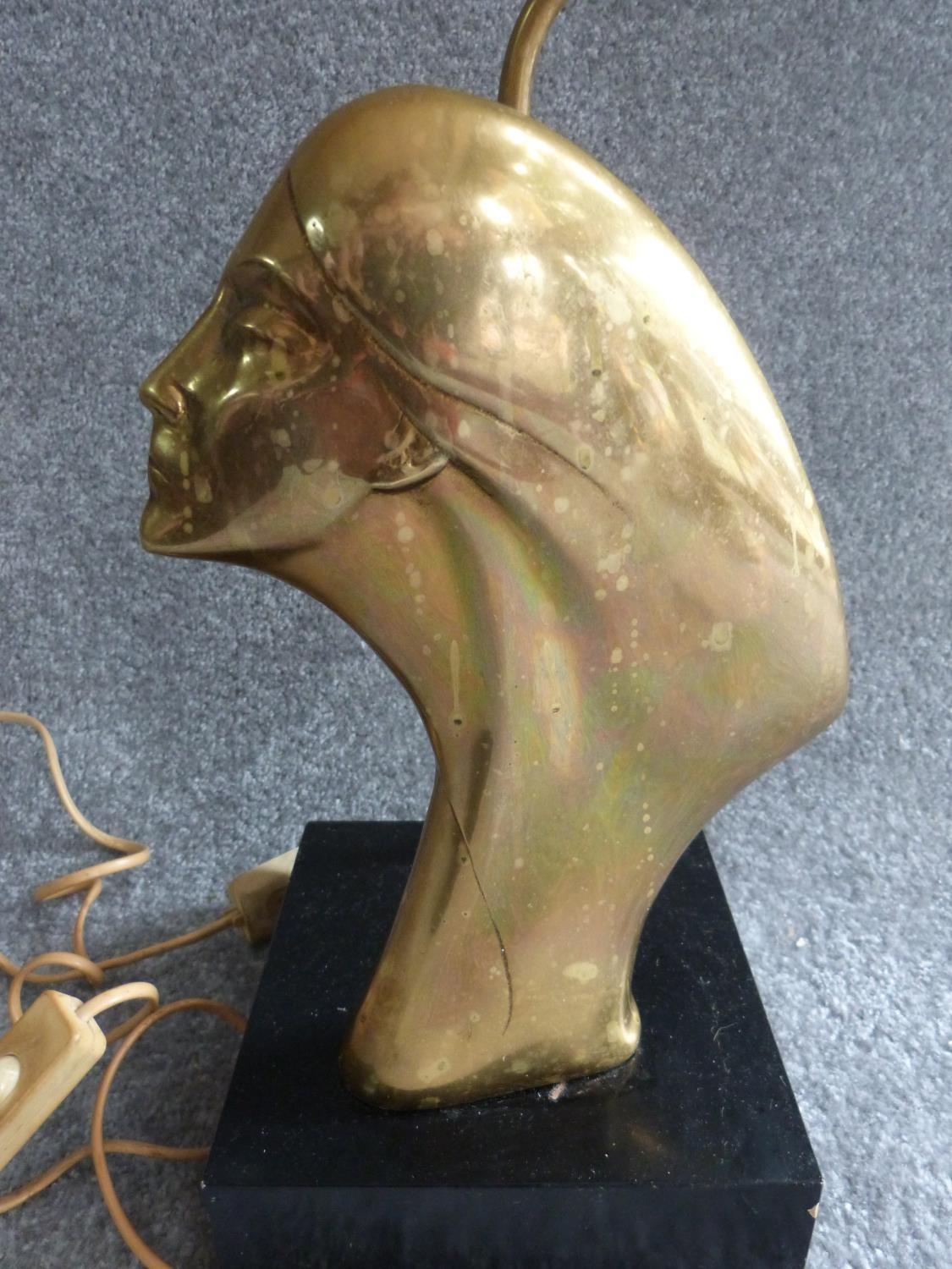 An Art Deco brass lamp with side profile of a lady, mounted on a painted wooden base. H 47cm. - Image 2 of 5