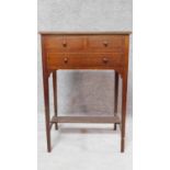 An Edwardian mahogany and ebony inlaid small side table fitted drawers on tapering square section