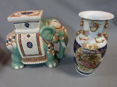 A ceramic elephant plant stand and a large Chinese oriental vase with birds and flowers and gilded