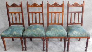 A set of four late 19th century oak dining chairs in Liberty fabric. H.104cm