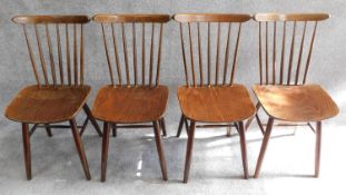 set of four vintage stained beech stick back dining chairs, label to underside.