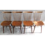 set of four vintage stained beech stick back dining chairs, label to underside.