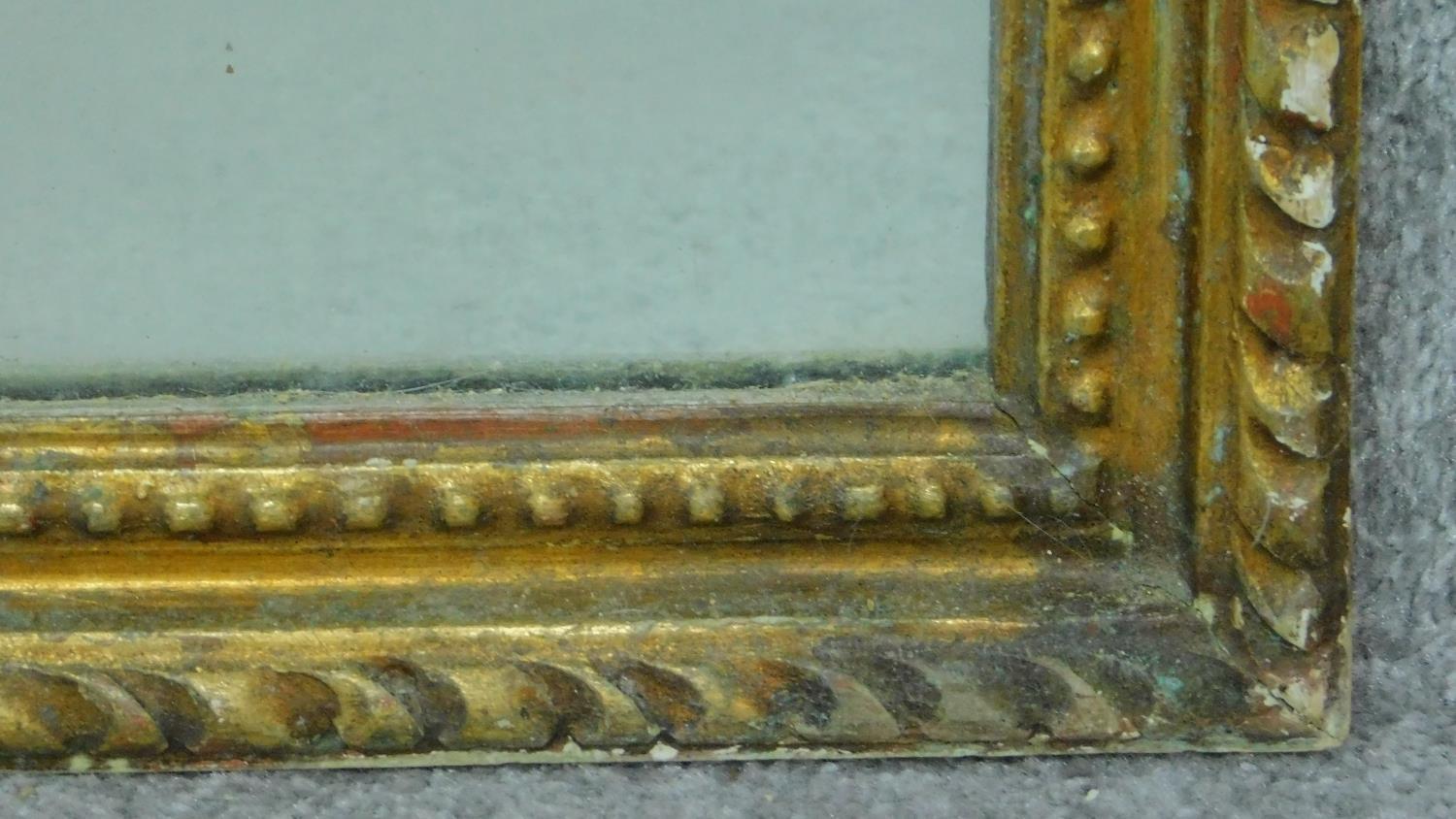 A late 19th century carved giltwood and gesso wall mirror with floral scroll cresting (parts - Image 6 of 7