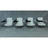 A set of four Vitra chrome and moulded student's desk chairs. H.79cm