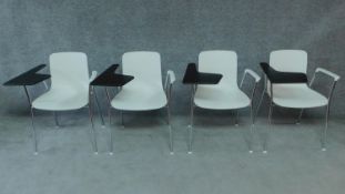 A set of four Vitra chrome and moulded student's desk chairs. H.79cm