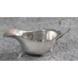 A hallmarked silver milk jug by Asprey & Co Ltd, London 1936. With elegant scrolling handle and