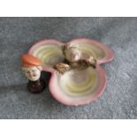 An Italian majolica seashell plate and porcelain head on wooden stand. Head signed 'porcellane, g.