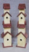 A pair of multi tiered bird houses. H.81cm