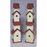 A pair of multi tiered bird houses. H.81cm