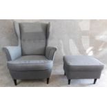 A contemporary vintage design wing back armchair and matching footstool. H.101cm