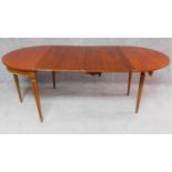 A French walnut demi lune foldover tea table with two extra leaves opening to a 6/8 seater dining