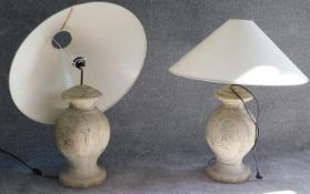 A pair of turned driftwood table lamps and shades. H.78cm